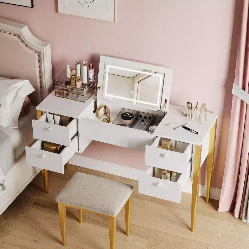 Une coiffeuse avec lumières et tabouret