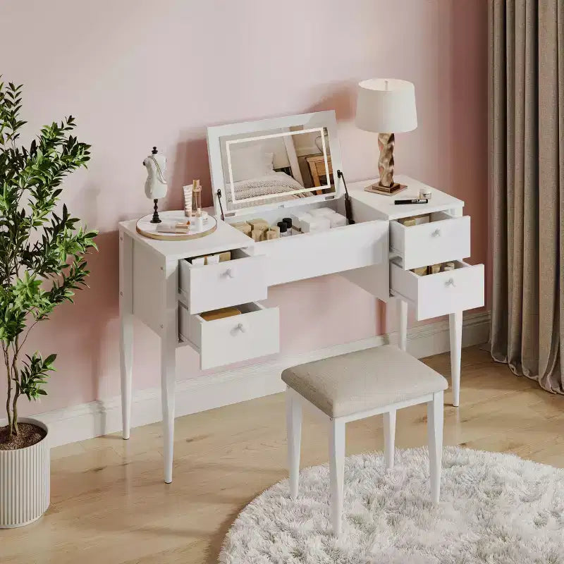 Une coiffeuse avec lumières et tabouret