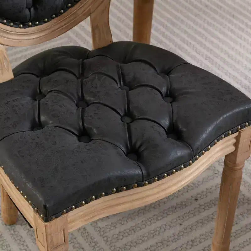 Deux chaises de salle à manger capitonnées élégantes