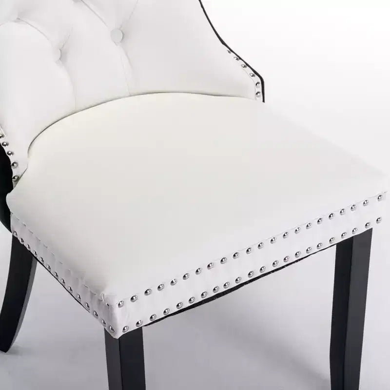 Deux chaises de salle à manger capitonnées bicolores